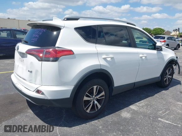 2018 Toyota RAV4 XLE with VIN 2T3WFREV9JW490324, listed as a IAAI auction lot 42298261 with 167,727 mi miles and . Bid and sale history available at DreamBid. Image 4.