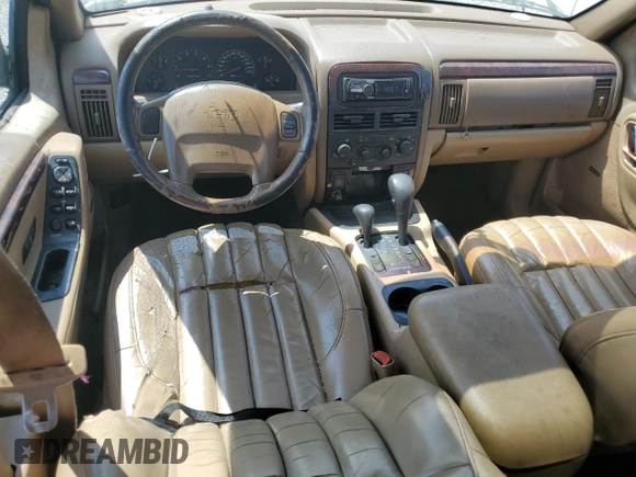 2000 Jeep Grand Cherokee Limited z VIN 1J4GW58N0YC272532, wystawiony jako Copart lot #57524225 z przebiegiem 238 921 mil mil oraz Szkoda całkowita • Salvage title. Historia ofert i sprzedaży dostępna na DreamBid. Obrazek 8.