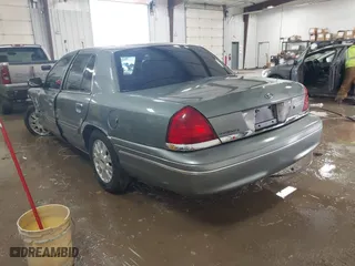 2005 Ford Crown Victoria LX with VIN 2FAFP74W05X124670, listed as a IAAI auction lot 41581963 with 135,486 mi miles. Bid and sale history available at carsss.com. Image 3.