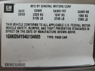 2004 Cadillac DeVille z VIN 1G6KD54Y64U134605, wystawiony jako Copart lot #56258215 z przebiegiem 256 662 mil mil oraz Szkody całkowita. Historia ofert i sprzedaży dostępna na DreamBid. Obrazek 13.