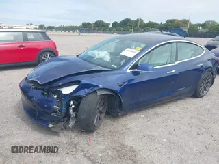 2020 Tesla Model 3 Standard Range Plus with VIN 5YJ3E1EA7LF785838, listed as a IAAI auction lot 41586081 with 38,392 mi miles and . Bid and sale history available at carsss.com. Image 2.