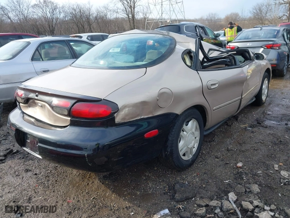1999 Ford Taurus SE with VIN 1FAFP53U3XA131984, listed as a IAAI auction lot 41638566 with 84,836 mi miles. Bid and sale history available at carsss.com. Image 4.