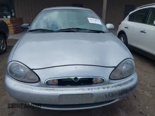 1997 Mercury Sable LS z VIN 1MELM53S5VA661602, wystawiony jako IAAI lot #42210072 z przebiegiem 106 344 mil mil oraz . Historia ofert i sprzedaży dostępna na DreamBid. Obrazek 6.
