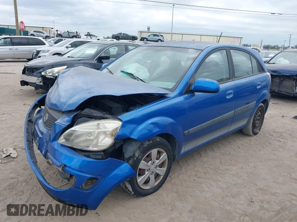 2009 Kia Rio LX with VIN KNADE243296494243, listed as a IAAI auction lot 41307888 with 133,487 mi miles. Bid and sale history available at carsss.com. Image 19.