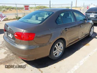 2014 Volkswagen Jetta S with VIN 3VW2K7AJ8EM319182, listed as a IAAI auction lot 42180101 with 133,495 mi miles and . Bid and sale history available at DreamBid. Image 4.