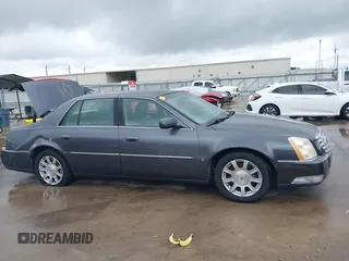 2009 Cadillac DTS 1SA z VIN 1G6KD57Y79U110350, wystawiony jako IAAI lot #42082318 z przebiegiem 94 369 mil mil oraz . Historia ofert i sprzedaży dostępna na DreamBid. Obrazek 13.