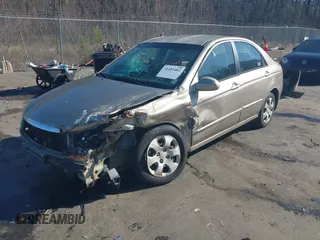 2004 Kia Spectra LX with VIN KNAFE121745039519, listed as a IAAI auction lot 41482402 with 201,123 mi miles. Bid and sale history available at carsss.com. Image 19.