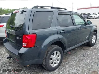 2008 Mazda Tribute Touring with VIN 4F2CZ02ZX8KM25983, listed as a IAAI auction lot 42122836 with 148,080 mi miles. Bid and sale history available at carsss.com. Image 4.