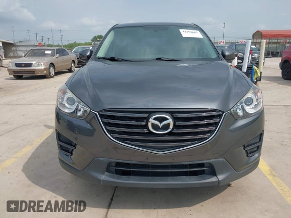 2016 Mazda CX-5 Sport with VIN JM3KE4BY8G0921243, listed as a IAAI auction lot 42102663 with 111,960 mi miles and . Bid and sale history available at DreamBid. Image 12.