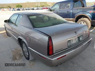 1997 Cadillac Eldorado ESC z VIN 1G6EL12YXVU619553, wystawiony jako IAAI lot #42324158 z przebiegiem 121 311 mil mil oraz . Historia ofert i sprzedaży dostępna na DreamBid. Obrazek 3.