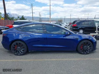 2022 Tesla Model 3 Performance with VIN 5YJ3E1EC1NF296758, listed as a IAAI auction lot 41960443 with 30,754 mi miles. Bid and sale history available at carsss.com. Image 13.