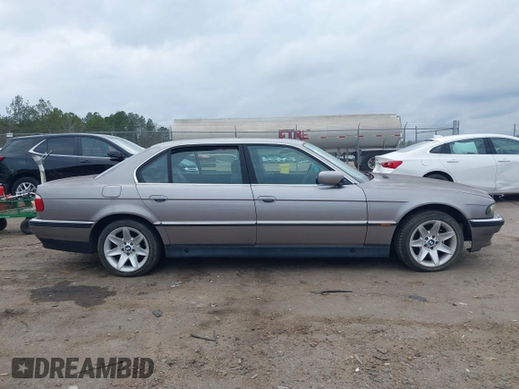 1998 BMW 7 Series 740il with VIN WBAGJ8323WDM23239, listed as a IAAI auction lot 41512630 with 221,673 mi miles. Bid and sale history available at carsss.com. Image 14.