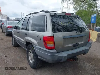 2001 Jeep Grand Cherokee Laredo z VIN 1J4GW48S01C658017, wystawiony jako IAAI lot #42160310 z przebiegiem 220 309 mil mil oraz . Historia ofert i sprzedaży dostępna na DreamBid. Obrazek 3.