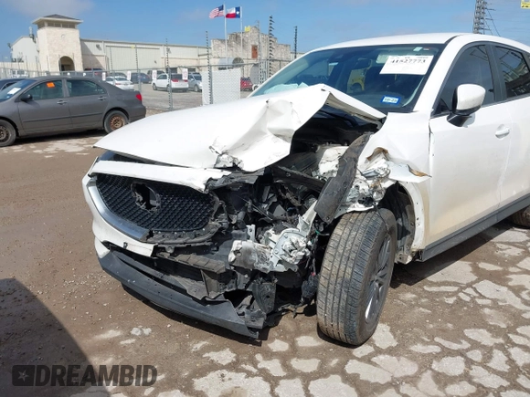 2020 Mazda CX-5 Touring with VIN JM3KFACM9L0771919, listed as a IAAI auction lot 41527773 with 93,417 mi miles and . Bid and sale history available at DreamBid. Image 6.