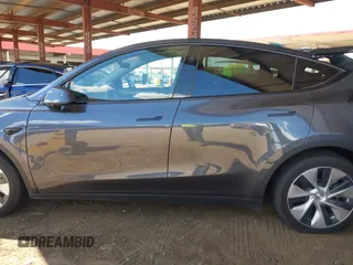 2023 Tesla Model Y Long Range with VIN 7SAYGDEE4PF875915, listed as a IAAI auction lot 42095178 with 11,928 mi miles and . Bid and sale history available at DreamBid. Image 14.