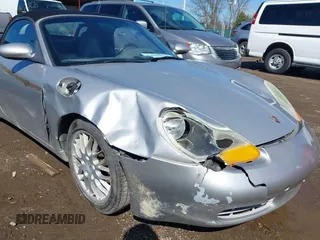 1999 Porsche Boxster z VIN WP0CA2989XU627152, wystawiony jako IAAI lot #41805432 z przebiegiem 112 380 mil mil oraz . Historia ofert i sprzedaży dostępna na DreamBid. Obrazek 6.