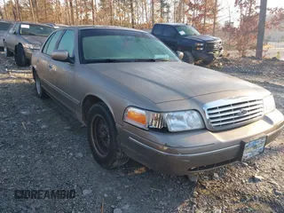 2002 Ford Crown Victoria LX z VIN 2FAFP74W32X159473, wystawiony jako IAAI lot #41759610 z przebiegiem 86 523 mil mil oraz . Historia ofert i sprzedaży dostępna na DreamBid. Obrazek 1.