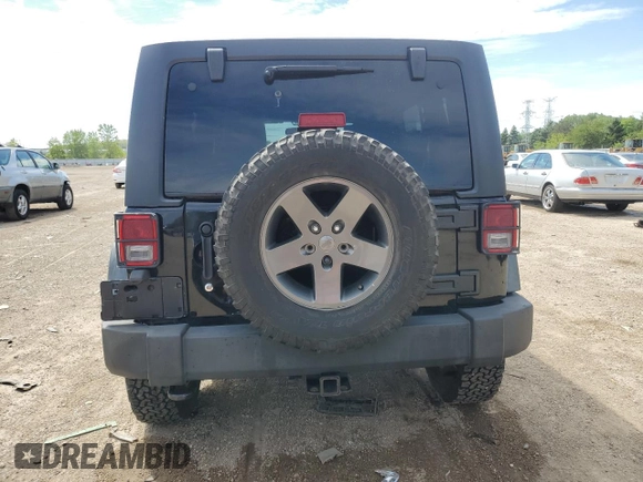 2011 Jeep Wrangler Unlimited Rubicon with VIN 1J4BA6H16BL561658, listed as a Copart auction lot 58379755 with 103,587 mi miles and Salvage title. Bid and sale history available at DreamBid. Image 6.