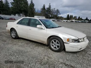 2000 Cadillac Seville Touring STS z VIN 1G6KY5497YU191639, wystawiony jako Copart lot #49658115 z przebiegiem 82 725 mil mil oraz Szkoda całkowita • Salvage title. Historia ofert i sprzedaży dostępna na DreamBid. Obrazek 4.