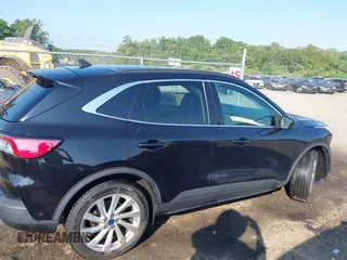 2021 Ford Escape Titanium Hybrid with VIN 1FMCU9DZ0MUB14833, listed as a IAAI auction lot 42593983 with 51,852 mi miles and . Bid and sale history available at DreamBid. Image 14.