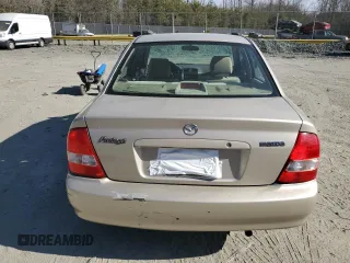 2002 Mazda Protege DX with VIN JM1BJ225520525472, listed as a Copart auction lot 45699915 with 183,457 mi miles and Salvage Title. Bid and sale history available at DreamBid. Image 6.