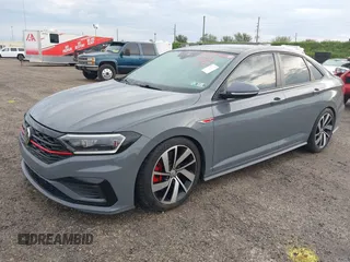 2021 Volkswagen Jetta GLI S with VIN 3VW6T7BU8MM011418, listed as a IAAI auction lot 40474082 with 76,619 mi miles and . Bid and sale history available at DreamBid. Image 2.