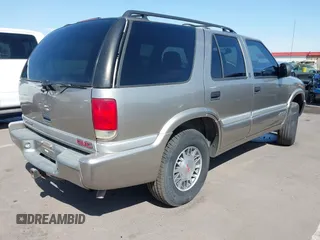 1999 GMC Jimmy SLE with VIN 1GKDT13W5X2539067, listed as a IAAI auction lot 41979222 with 1 mi miles. Bid and sale history available at carsss.com. Image 4.