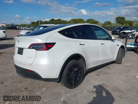 2023 Tesla Model Y Long Range z VIN 7SAYGDEE0PA128888, wystawiony jako IAAI lot #41410085 z przebiegiem 12 578 mil mil oraz . Historia ofert i sprzedaży dostępna na DreamBid. Obrazek 4.