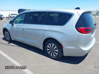 2023 Chrysler Pacifica Hybrid Touring L with VIN 2C4RC1L75PR614460, listed as a IAAI auction lot 42628545 with 68,668 mi miles and . Bid and sale history available at DreamBid. Image 3.