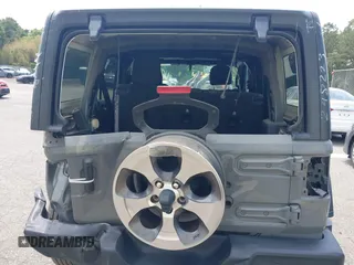 2020 Jeep Wrangler Unlimited Black and Tan with VIN 1C4HJXDG3LW298223, listed as a IAAI auction lot 42446032 with 17,688 mi miles and . Bid and sale history available at DreamBid. Image 16.