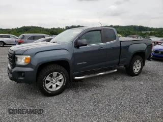 2015 GMC Canyon 2WD SLE with VIN 1GTH5BEA7F1158758, listed as a Copart auction lot 63617524 with 102,744 mi miles and Salvage Title. Bid and sale history available at carsss.com. Image 1.