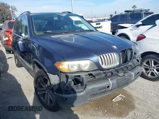 2005 BMW X5 4.4i with VIN 5UXFB53505LV12919, listed as a IAAI auction lot 41458512 with 128,518 mi miles. Bid and sale history available at carsss.com. Image 1.