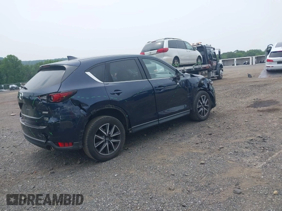 2018 Mazda CX-5 Grand Touring with VIN JM3KFBDMXJ0361812, listed as a IAAI auction lot 42509752 with 131,386 mi miles and . Bid and sale history available at DreamBid. Image 4.