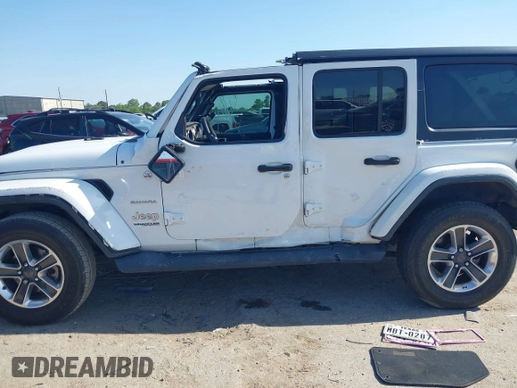 2019 Jeep Wrangler Unlimited Sahara with VIN 1C4HJXEG0KW577917, listed as a IAAI auction lot 41993670 with 90,584 mi miles and . Bid and sale history available at DreamBid. Image 14.