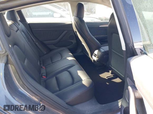 2023 Tesla Model 3 with VIN 5YJ3E1EA9PF548502, listed as a IAAI auction lot 41160649 with 28,759 mi miles and . Bid and sale history available at carsss.com. Image 8.