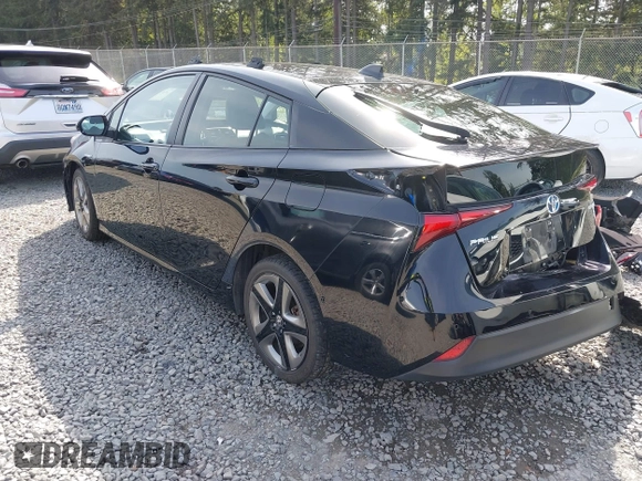 2021 Toyota Prius L Eco with VIN JTDKAMFU8M3136565, listed as a IAAI auction lot 42161896 with 39,634 mi miles and . Bid and sale history available at DreamBid. Image 3.
