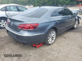 2013 Volkswagen CC Executive z VIN WVWGU7AN8DE520610, wystawiony jako IAAI lot #42278719 z przebiegiem 197 905 mil mil oraz . Historia ofert i sprzedaży dostępna na DreamBid. Obrazek 4.