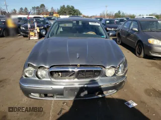 2004 Jaguar XJ with VIN SAJWA71C74SG34056, listed as a Copart auction lot 80083014 with 0 mi miles and Salvage Title. Bid and sale history available at carsss.com. Image 5.