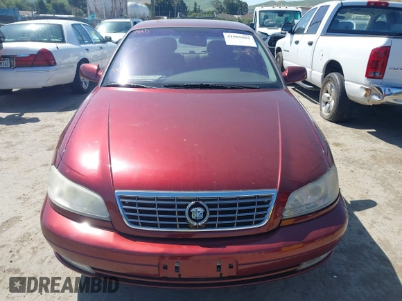 2001 Cadillac Catera z VIN W06VR54R01R003061, wystawiony jako IAAI lot #41989882 z przebiegiem 77 248 mil mil oraz . Historia ofert i sprzedaży dostępna na DreamBid. Obrazek 6.