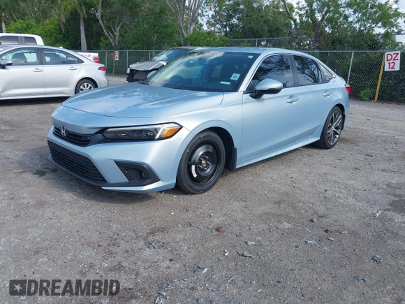 2023 Honda Civic Touring with VIN 2HGFE1F91PH305053, listed as a IAAI auction lot 42378311 with 41,576 mi miles and . Bid and sale history available at DreamBid. Image 2.