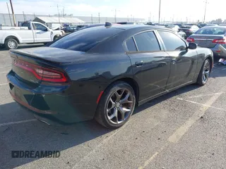 2015 Dodge Charger SXT with VIN 2C3CDXHG9FH915191, listed as a IAAI auction lot 41850427 with 164,535 mi miles and . Bid and sale history available at DreamBid. Image 4.