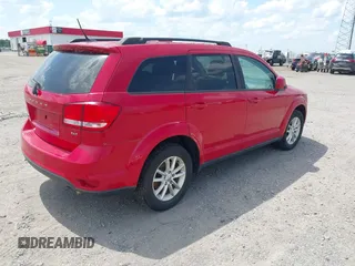 2013 Dodge Journey SXT with VIN 3C4PDDBGXDT641427, listed as a IAAI auction lot 42604902 with 149,256 mi miles and . Bid and sale history available at DreamBid. Image 4.
