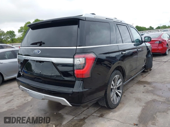 2019 Ford Expedition Platinum with VIN 1FMJU1MT8KEA02325, listed as a IAAI auction lot 41861772 with 77,124 mi miles. Bid and sale history available at carsss.com. Image 4.