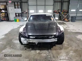 2012 Nissan 370Z z VIN JN1AZ4EH2CM564443, wystawiony jako Copart lot #45126885 z przebiegiem 71 729 mil mil oraz Szkody całkowita. Historia ofert i sprzedaży dostępna na DreamBid. Obrazek 11.