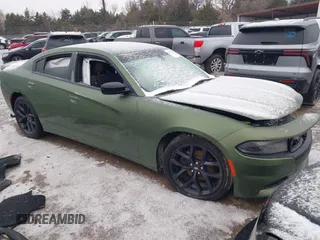 2021 Dodge Charger SXT with VIN 2C3CDXBG5MH570330, listed as a IAAI auction lot 41558328 with 119,828 mi miles. Bid and sale history available at carsss.com. Image 1.