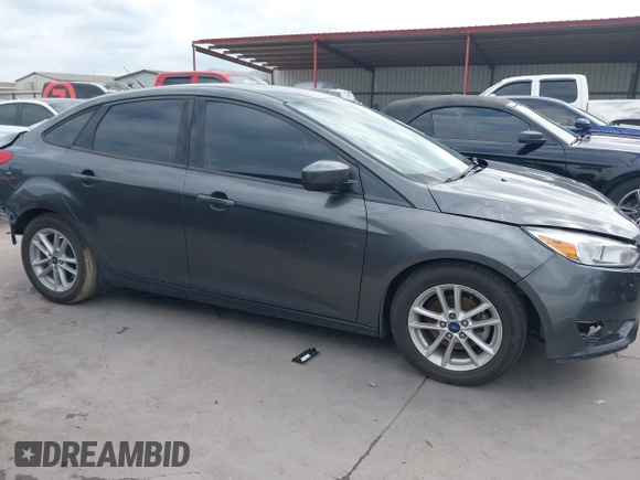 2018 Ford Focus SE with VIN 1FADP3F22JL295342, listed as a IAAI auction lot 42335881 with 77,464 mi miles and . Bid and sale history available at DreamBid. Image 14.