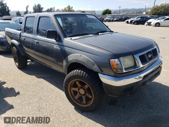 2000 Nissan Frontier XE with VIN 1N6ED27T5YC426456, listed as a Copart auction lot 54411425 with 117,600 mi miles and Salvage title. Bid and sale history available at DreamBid. Image 4.