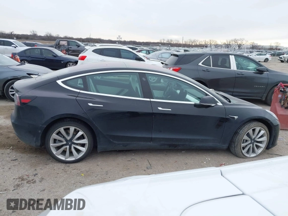 2018 Tesla Model 3 Long Range Battery with VIN 5YJ3E1EB9JF188437, listed as a IAAI auction lot 41371254 with 55,934 mi miles and . Bid and sale history available at DreamBid. Image 13.
