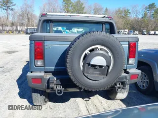 2005 Hummer H2 SUT with VIN 5GRGN22U15H114401, listed as a IAAI auction lot 41268764 with 166,651 mi miles. Bid and sale history available at carsss.com. Image 16.