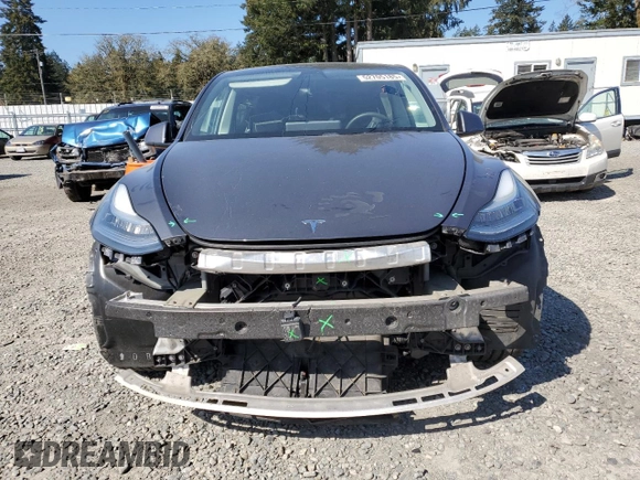2020 Tesla Model Y Long Range with VIN 5YJYGDEEXLF017789, listed as a Copart auction lot 52705185 with 49,470 mi miles and Salvage Title. Bid and sale history available at DreamBid. Image 5.